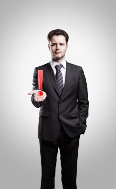 Young businessman with an exclamation mark on his hand clipart