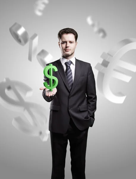 Jonge zakenman kiest ons dollarteken een groene — Stockfoto