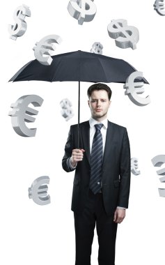 Business man with umbrella under evro and dollar signs rain clipart