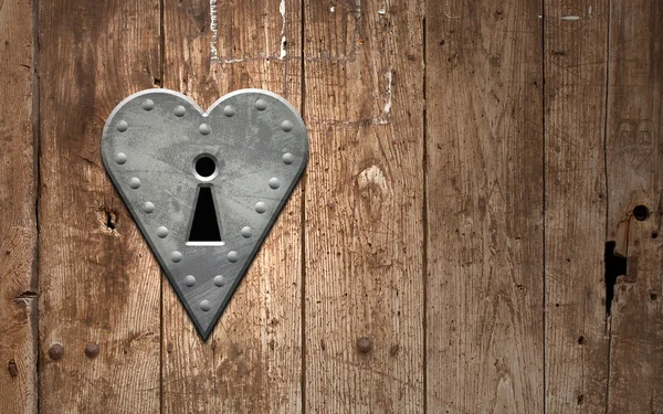 Hart sleutelgat op een houten deur — Stockfoto