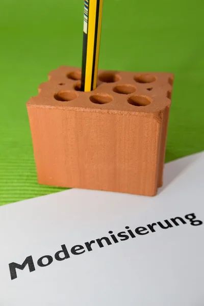 Brick with pencil and contract — Stock Photo, Image