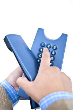 Hands holding phone, dialling a number clipart