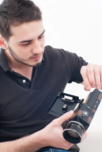 stock image Male holding video camera