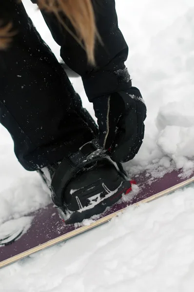 Securing bindings from snowboard — Stock Photo, Image