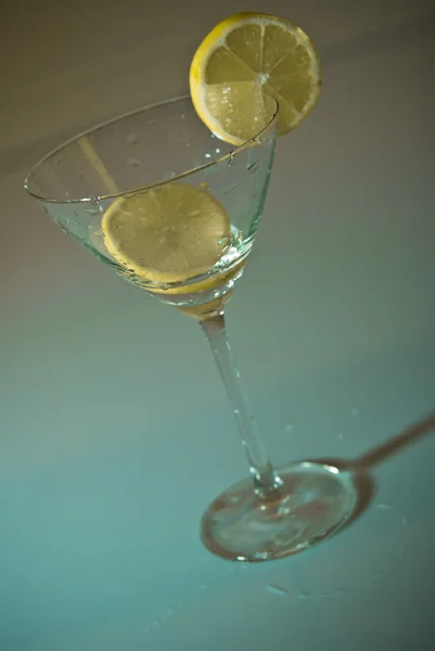 stock image Glass of water with lemon inside