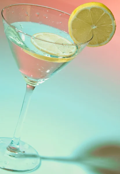 stock image Glass of water with lemon inside