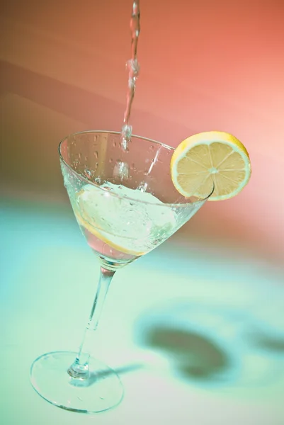 stock image Glass of water with lemon inside