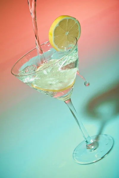 stock image Glass of water with lemon inside