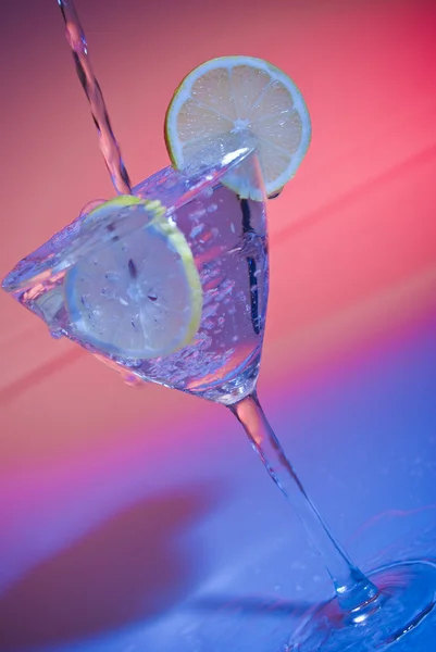 Stock image Glass of water with lemon inside