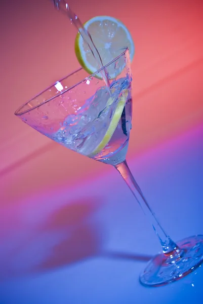 stock image Glass of water with lemon inside