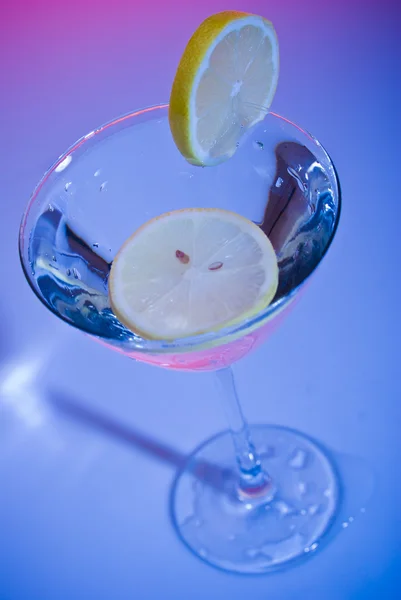 stock image Glass of water with lemon inside