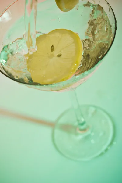 stock image Glass of water with lemon inside