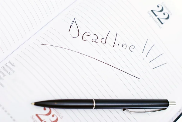 Agenda with deadline date and pen — Stock Photo, Image