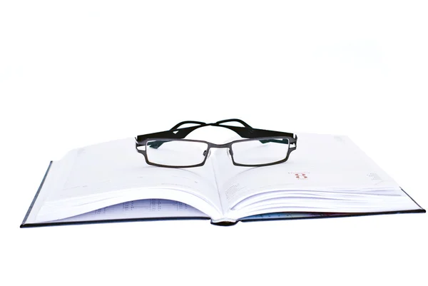 在议程上的眼镜 免版税图库图片