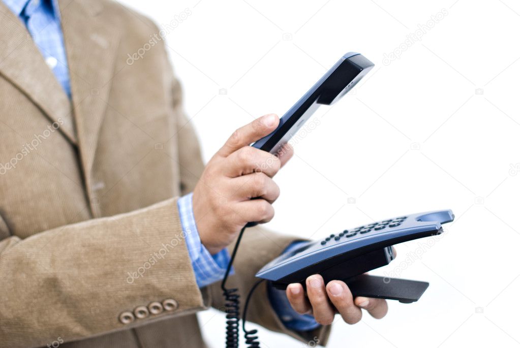Manager holding desk phone