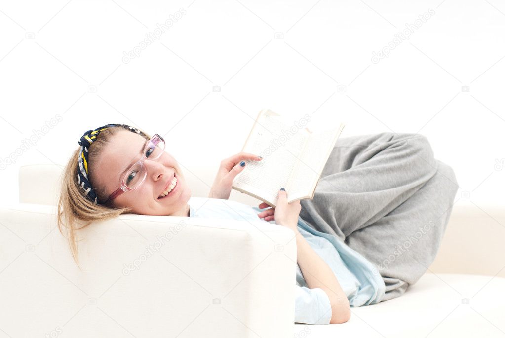 Relaxed girl, on the sofa, smiling