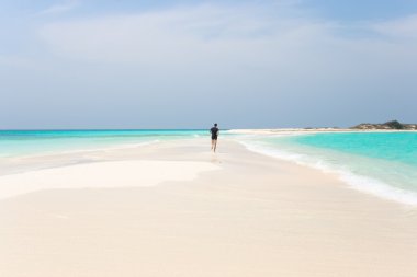 Man jogging on the beach clipart