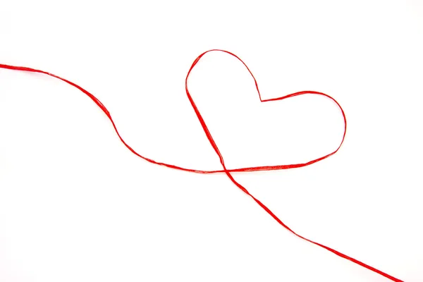 Gift ribbon drawing a heart — Stock Photo, Image