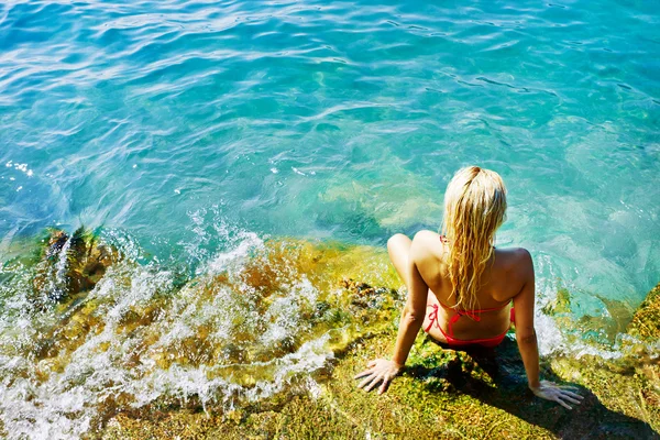 stock image Young attractive woman near the water