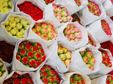 Bouquets of flowers ready at the market clipart