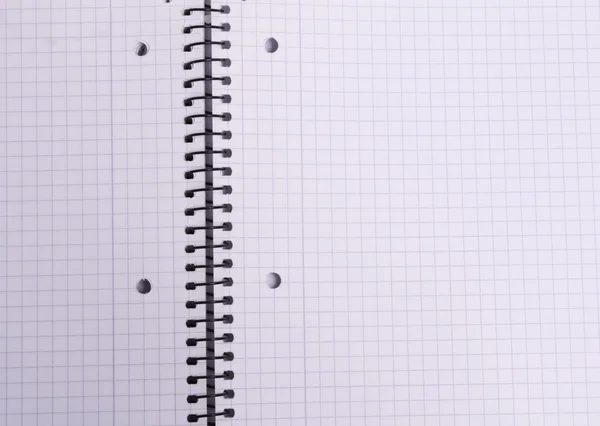Checkered sheet spiral notebook — Stock Photo, Image