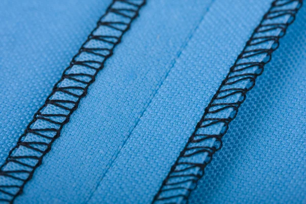 Seam in blue woven fabric — Stock Photo, Image