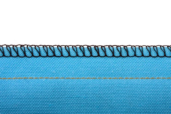 Шов из голубой ткани — стоковое фото