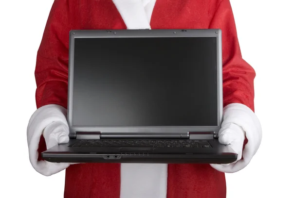 Santa claus innehar en laptop — Stockfoto