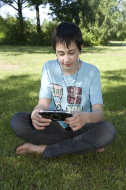 Boy with Playstation clipart