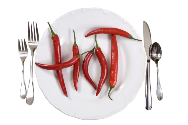 Hot chili peppers on a plate — Stock Photo, Image