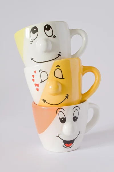 stock image Three cups with happy expression