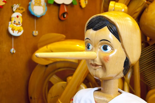 Wooden Pinocchio doll with long nose — Stock Photo, Image