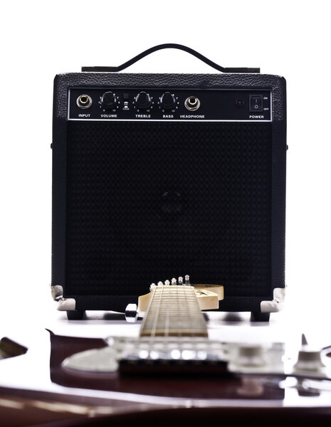 Electric guitar and amplifier isolated on the white backgroud