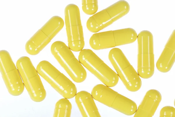 Gele capsules — Stockfoto