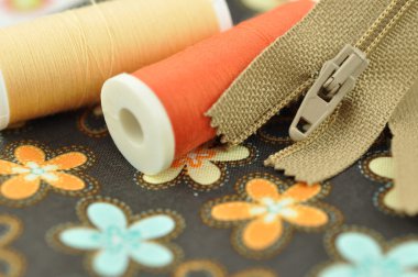 Sewing Items on Floral Cloth clipart