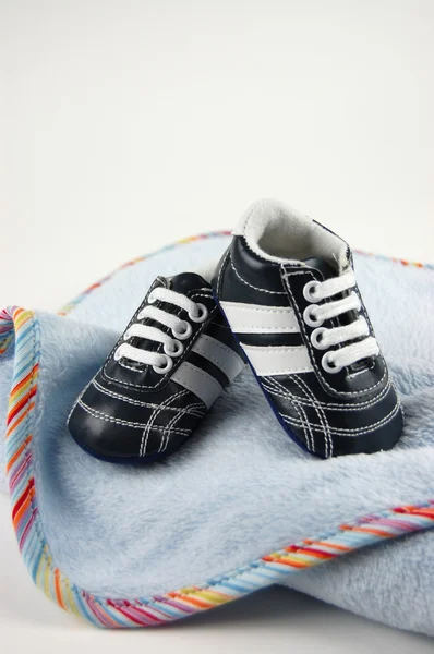 Babyfilt och skor — Stockfoto