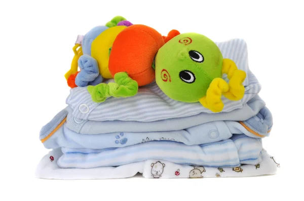 Kleurrijke speelgoed op kleren van de baby — Stockfoto