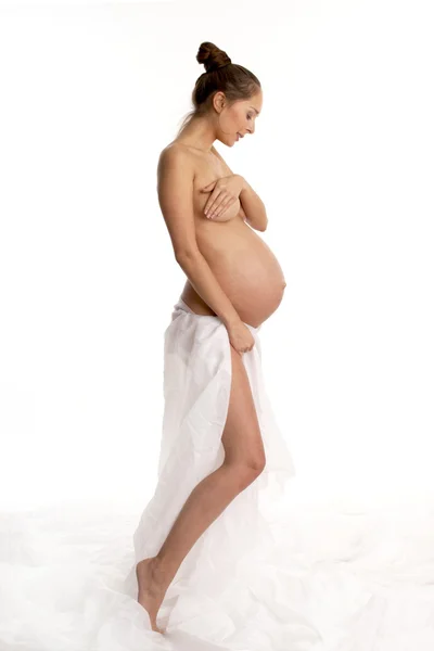 Kobieta w ciąży w kolorze białym — Zdjęcie stockowe