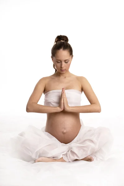 Těhotná žena v meditaci Stock Fotografie