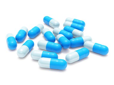 Many blue-gray pills on white