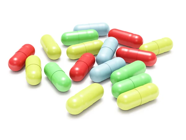 Vele gekleurde pillen op wit — Stockfoto
