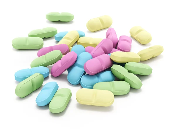 Viele farbige Pillen auf weiß — Stockfoto