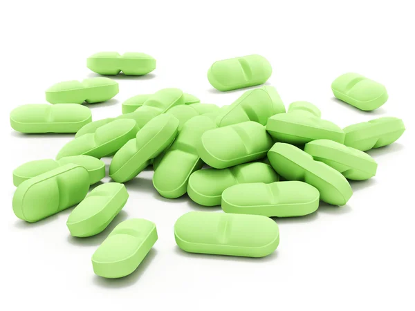 Πράσινα χάπια σε λευκό φόντο — Φωτογραφία Αρχείου