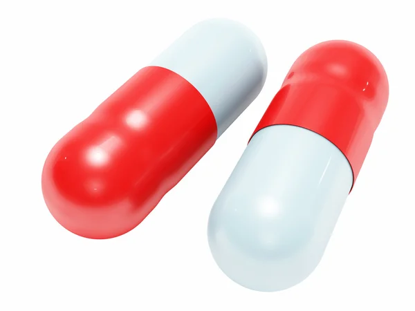 Dwa błyszczący biały niebieski medycznych tabletki na białym tle — Zdjęcie stockowe