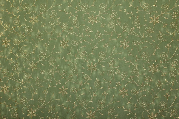 Green art paper with golden glitter floral pattern — Stock Photo, Image