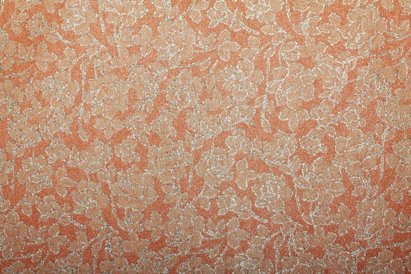 Orange glittered handmade art paper with floral pattern — Stock Photo, Image
