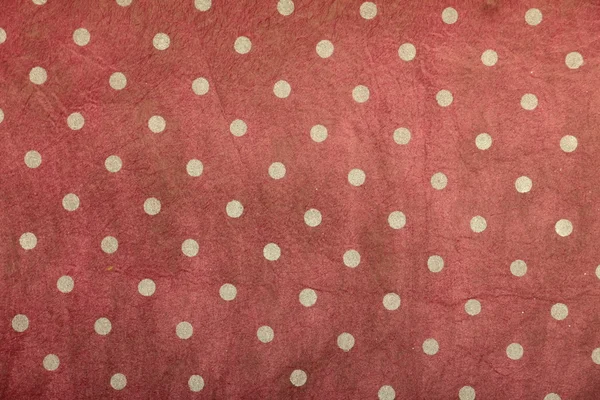 Red creased shaded handmade art paper with polka dots — Stock Photo, Image