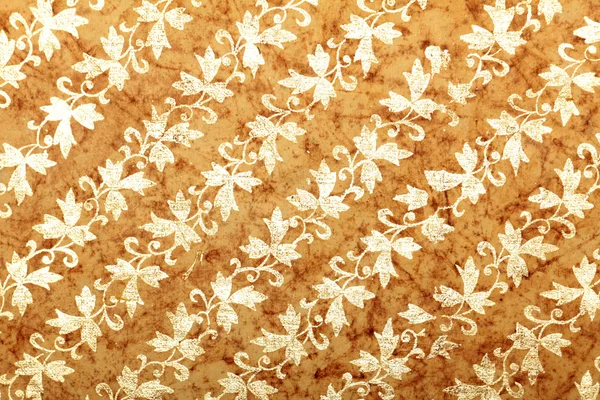 Brown handmade art paper with diagonal floral pattern — Stock Photo, Image