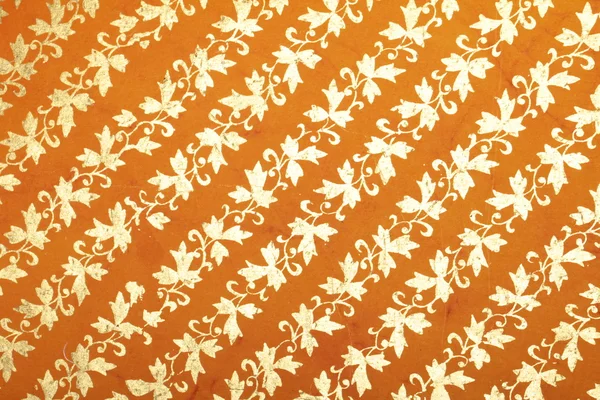 Orange handmade art paper with diagonal floral pattern — Stock Photo, Image