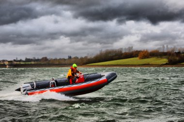 Speedboat on a lake clipart